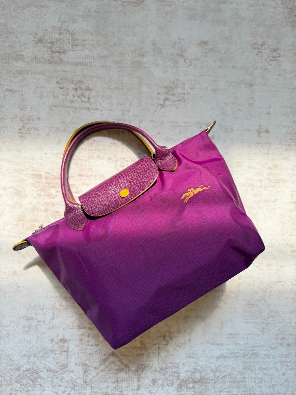 Longchamp Purple Top-Handle Tote with Gold Emblem